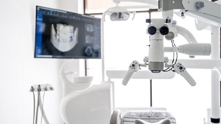 Dental operatory with monitor displaying results of dental scan