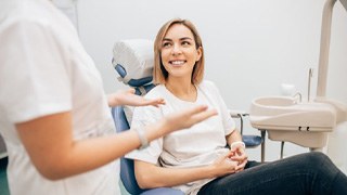 woman talking to her dentist in Lakeville about root canals 