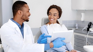 Lakeville implant dentist explaining dental implants to patient