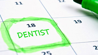 Dentist appointment highlighted in green on calendar