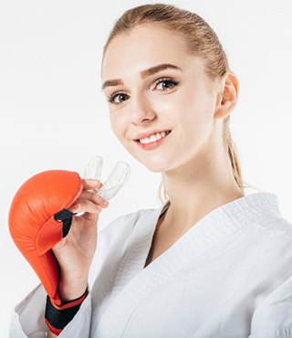 young female athlete with mouthguard 