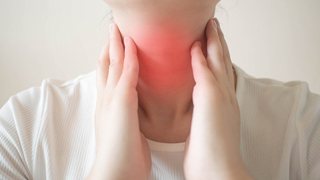 woman with sore throat