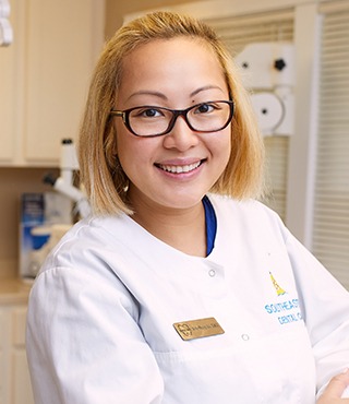 Young woman in dental chair smiling