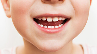 Closeup of child's healthy smile