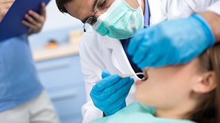 Patient receiving oral cancer screening