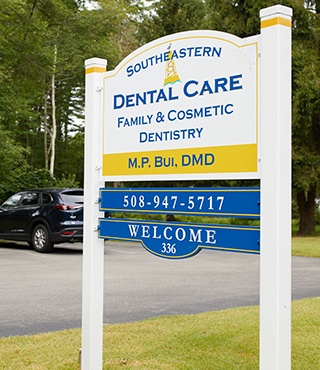 Older man receiving dental examination