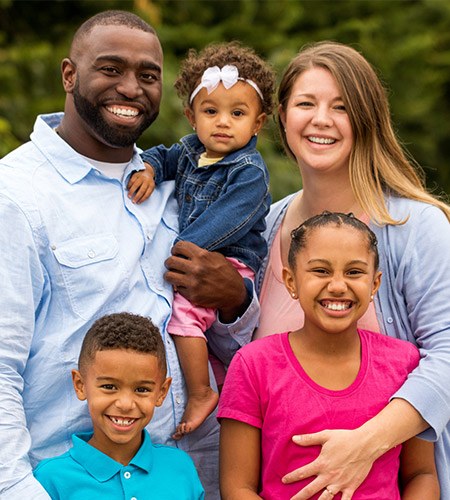 Smiling family of five