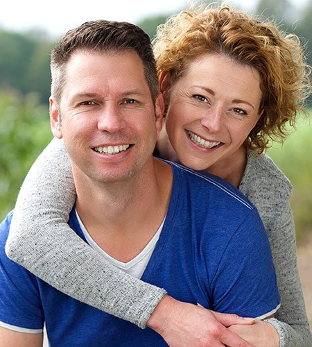 Man and woman smiling happily