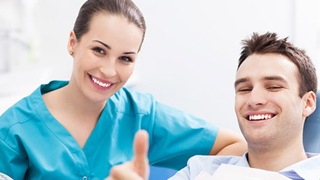 patient smiling with dentist