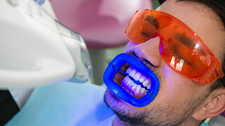 Man receiving professional teeth whitening