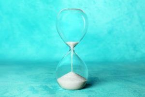 Sand in hourglass to illustrate deadline for 2020 dental insurance