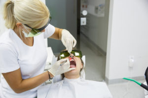 Patient receiving laser dentistry services